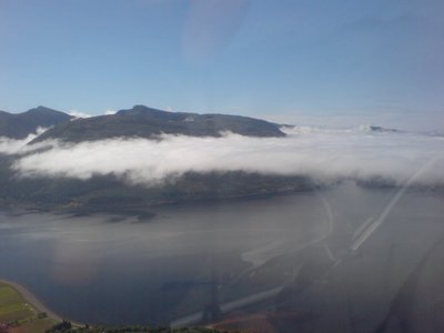 Diving below clouds on the approach to Oban